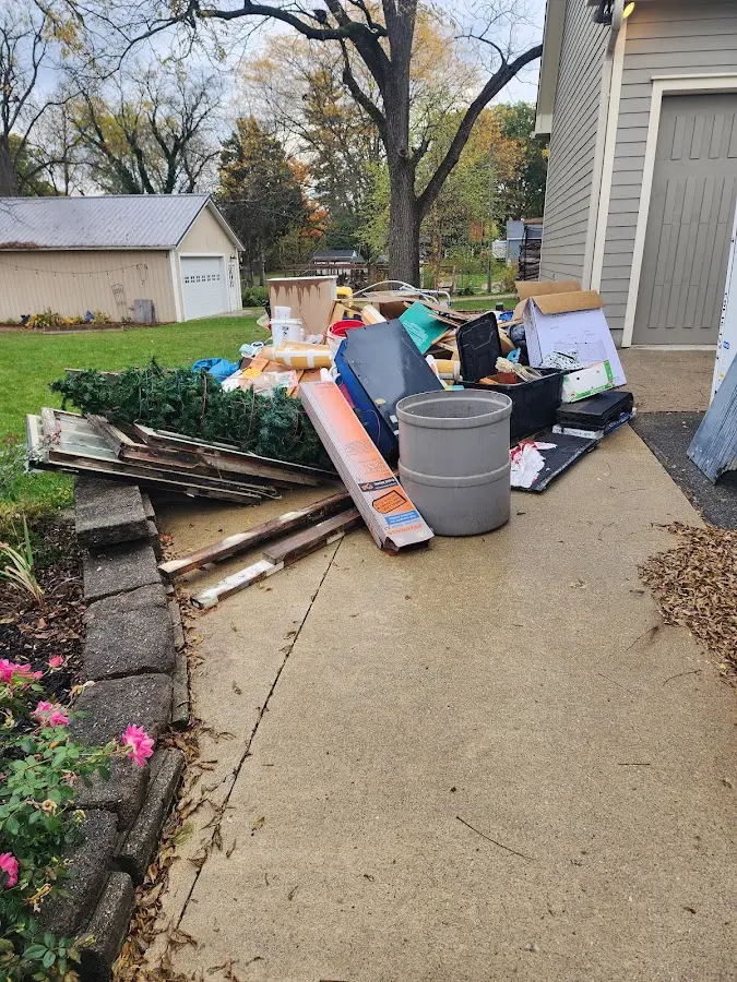 Dumpster being loaded with debris for Demolition Dumpster Rental in Pixley